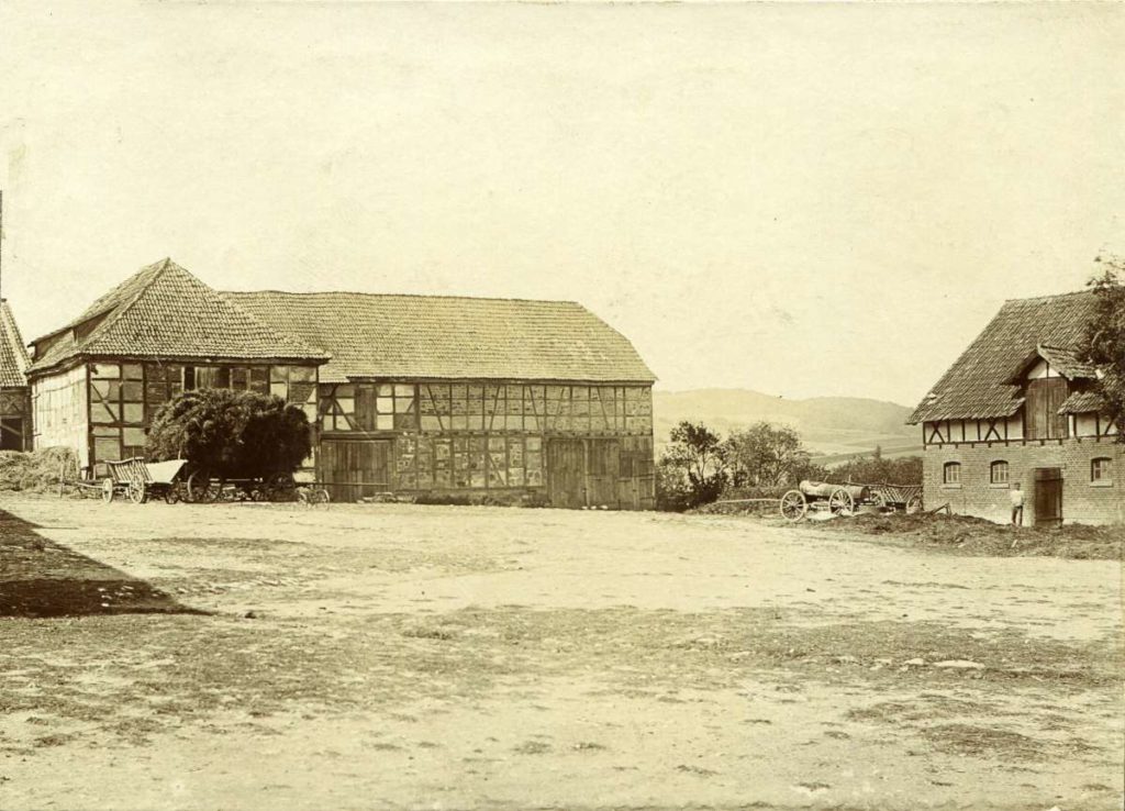Barn and cowshed with hay cart